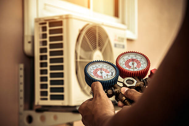 Professional Hvac technician working in Rossville, MD